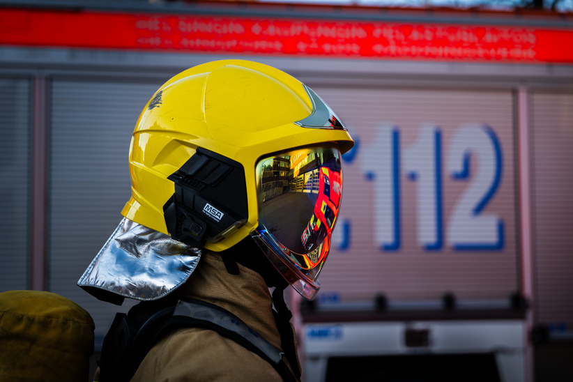 A Rescuer standing with helmet. 